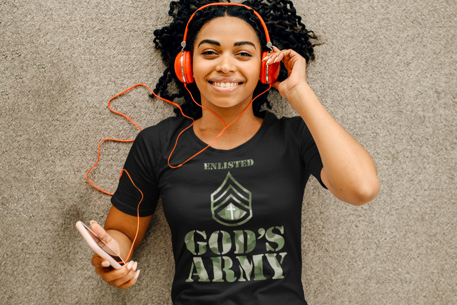 A camouflage-style black print T-shirt featuring the powerful design of God&
