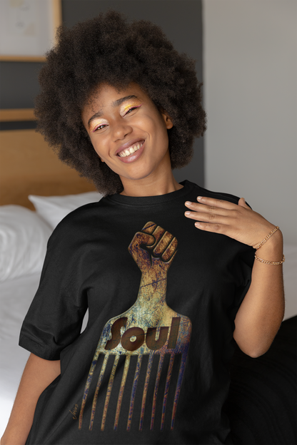 Retro Soul Afro Pick T-Shirt – A 100% cotton tee featuring a distinctive strong fist graphic handle, combining retro vibes with modern style for a powerful and empowering fashion statement